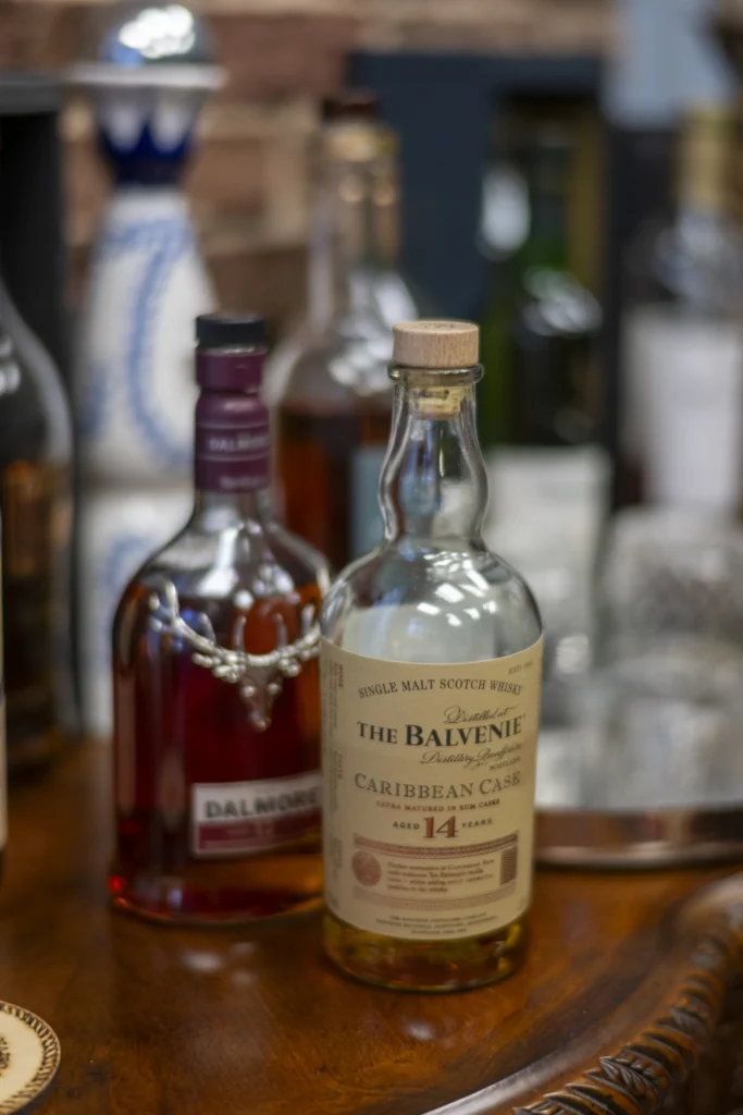 A selection of premium whiskey bottles sits on display in the Parker-Baker Law office. The refined setting reflects the firm's welcoming and sophisticated atmosphere.